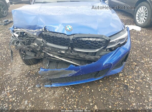 3MW5U9J04M8B69167 2021 BMW M3 Blue Rear view