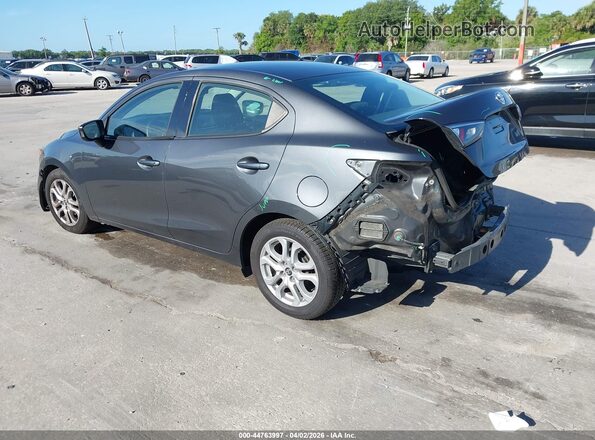 3MYDLBYV1JY313779 2018 TOYOTA YARIS IA Gray Rear left