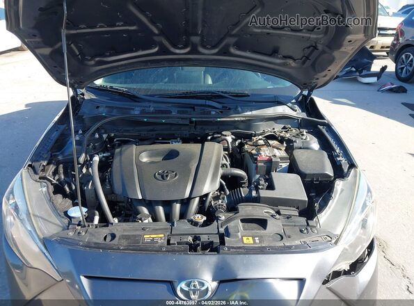 3MYDLBYV1JY313779 2018 TOYOTA YARIS IA Gray Rear view