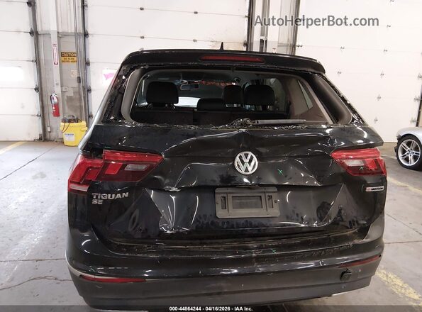 3VV2B7AX0LM058183 2020 VOLKSWAGEN TIGUAN Black Front view
