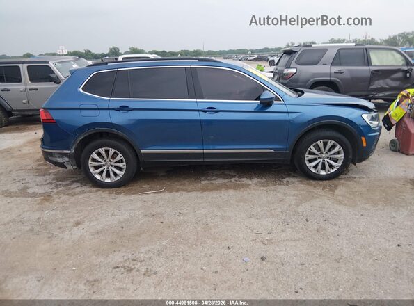 3VV2B7AX5JM092150 2018 VOLKSWAGEN TIGUAN Blue Vista interior trasera