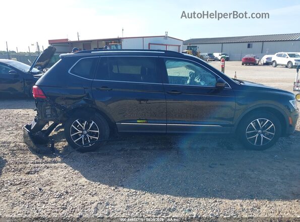 3VV3B7AX2MM080644 2021 VOLKSWAGEN TIGUAN Black Rear interior view
