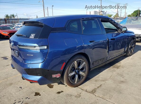 WB523CF06RCP23335 2024 BMW IX Blue Delantero derecho