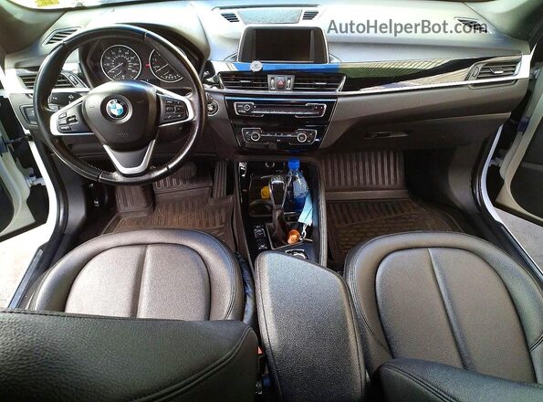 WBXHT3C3XGP880243 2016 BMW X1 White Вид задніх сидінь
