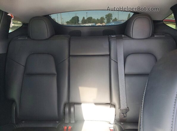 7SAYGDEE0PA052489 2023 TESLA MODEL Y White Vista interior trasera
