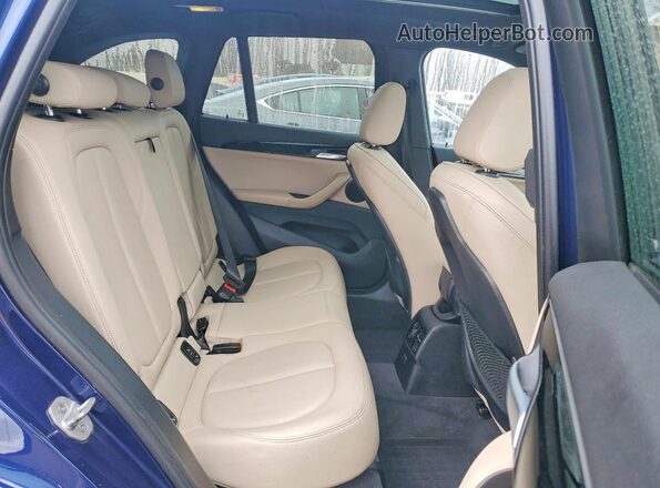 WBXJG9C07L5P84395 2020 BMW X1 Blue Vista interior trasera
