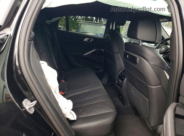 5UX33EX02S9X29007 2025 BMW X6 Black უკანა სალონის ხედი