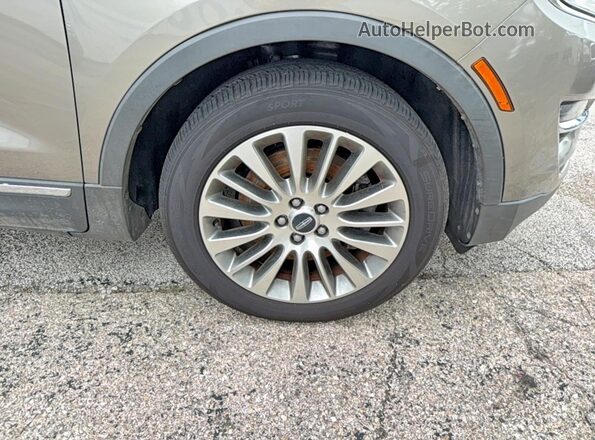 5LMCJ3D90HUL69989 2017 LINCOLN MKC Brown Vista de la etiqueta del VIN