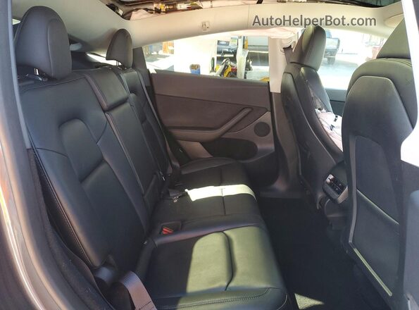 7SAYGDED3PF941314 2023 TESLA MODEL Gray Rear interior view
