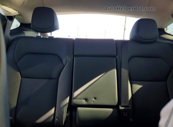 7SAYGDED9TF542272 2026 TESLA MODEL White Rear seats view