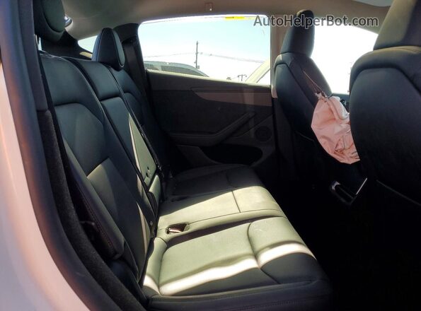 7SAYGDED9TF542272 2026 TESLA MODEL White Rear interior view