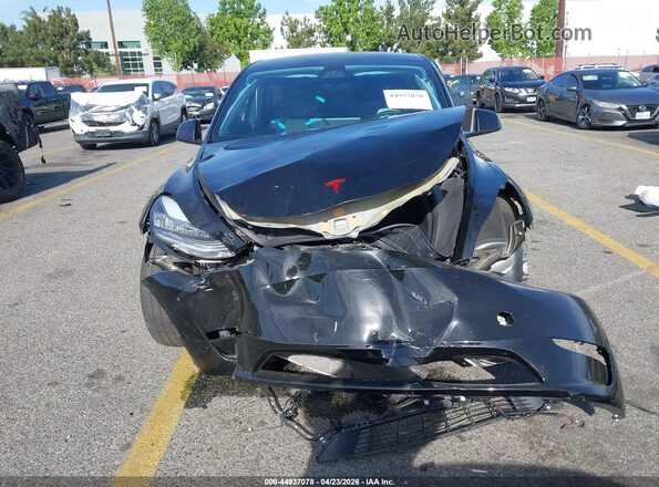 7SAYGDEE5PA154743 2023 TESLA MODEL Y Black Սալոնի հետևի տեսք