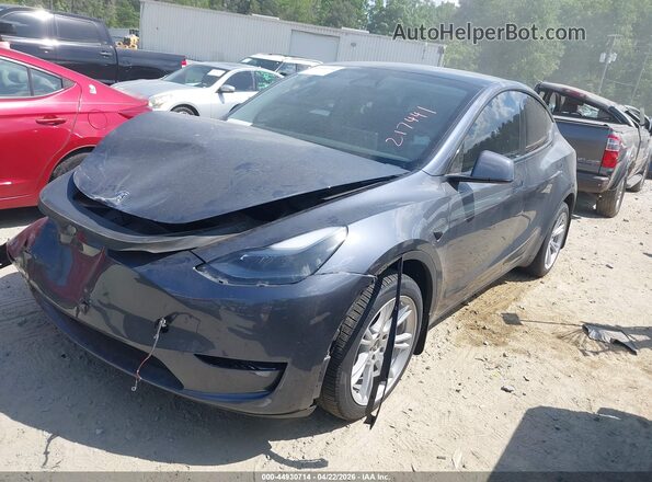 7SAYGDEE5RA217441 2024 TESLA MODEL Y Gray Առջևի ձախ երեք քառորդ տեսարան