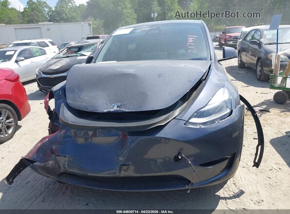 7SAYGDEE5RA217441 2024 TESLA MODEL Y Gray Սարքավորումների վահանակի տեսք
