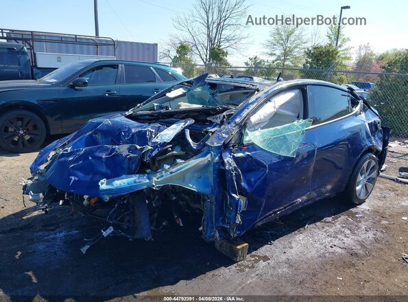7SAYGDEE6NF395310 2022 TESLA MODEL Y Blue Առջևի ձախ երեք քառորդ տեսարան