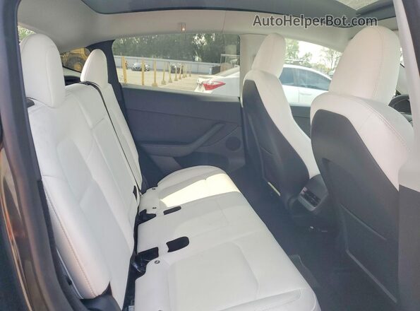 7SAYGDEE7RF001965 2024 TESLA MODEL Black Vista interior trasera