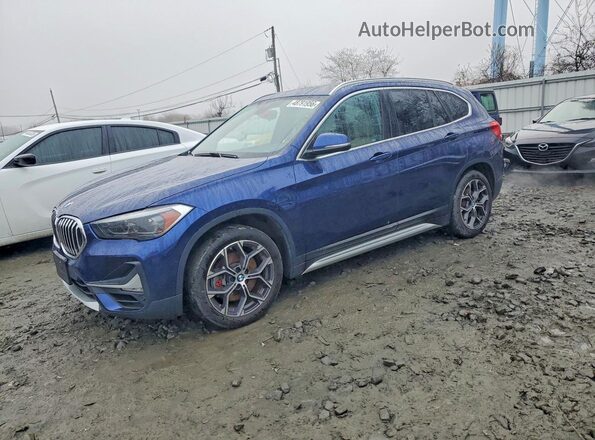 WBXJG9C07L5P84395 2020 BMW X1 Blue Trasero izquierdo
