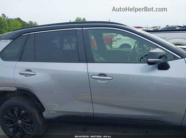 JTME6RFV4PD542572 2023 TOYOTA RAV4 HYBRID Silver Rear interior view