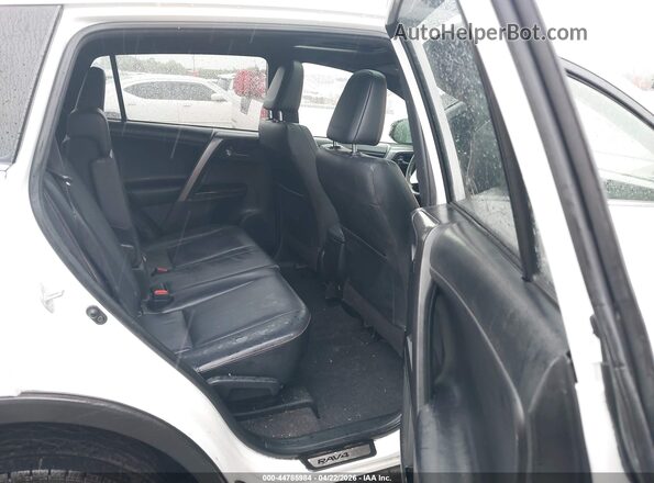 JTMJFREV0JJ227602 2018 TOYOTA RAV4 White VIN sticker view