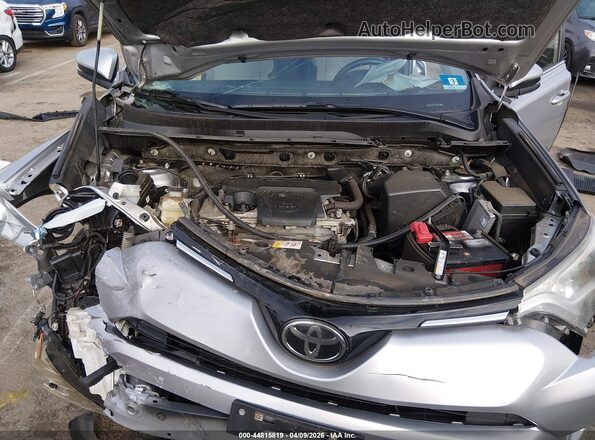 JTMRFREV5JJ211284 2018 TOYOTA LE Silver Rear view