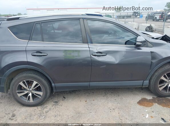 JTMWFREV6JJ155083 2018 TOYOTA LE Gray Vista interior trasera
