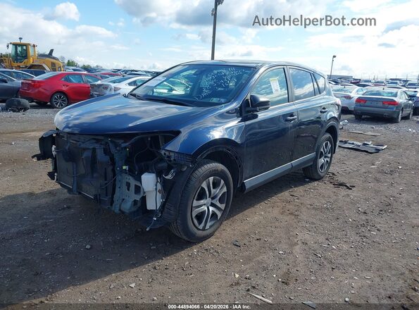 JTMZFREV4JJ748678 2018 TOYOTA LE Dark Blue Front left