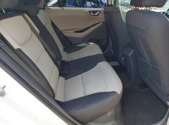 KMHC65LC0HU049570 2017 HYUNDAI IONIQ White Rear seats view
