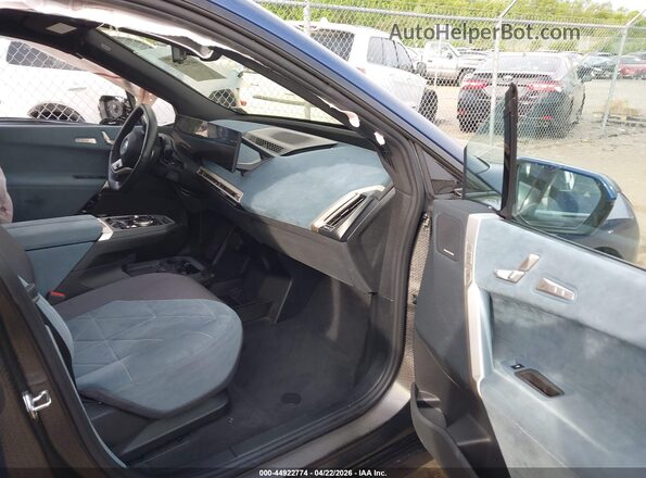 WB523CF02RCS04377 2024 BMW IX Navy Widok wnętrza z przodu