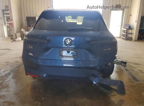 WB523CF06RCP11220 2024 BMW IX Blue Հետևի տեսք