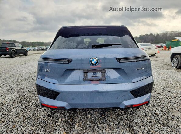 WB523CF09RCN79618 2024 BMW IX Blue Հետևի տեսք