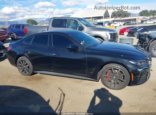 WBA63AV01RFR25619 2024 BMW 4 SERIES Black Սալոնի հետևի տեսք