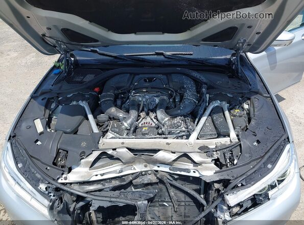 WBA7F0C50KGM25875 2019 BMW 7 SERIES Silver Rear view
