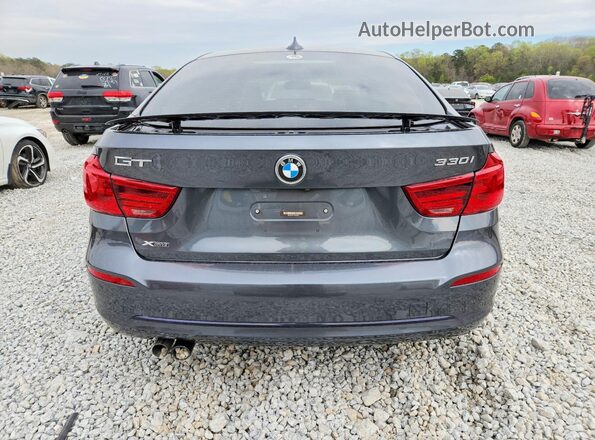 WBA8Z9C51JB220562 2018 BMW 7 SERIES Gray Вид ззаду