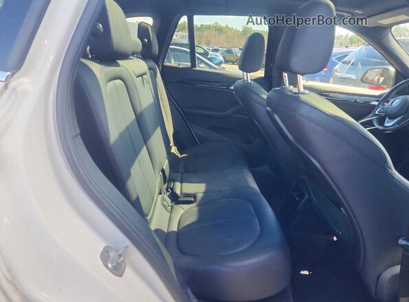 WBXHT3C30J5K20618 2018 BMW X1 White Rear seats view