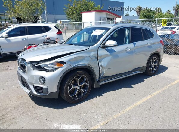 WBXHT3C31GP886433 2016 BMW X1 Серебряный Передняя левая четверть