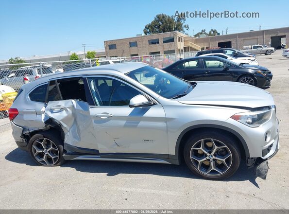 WBXHT3C31GP886433 2016 BMW X1 Серебряный Вид задней части салона