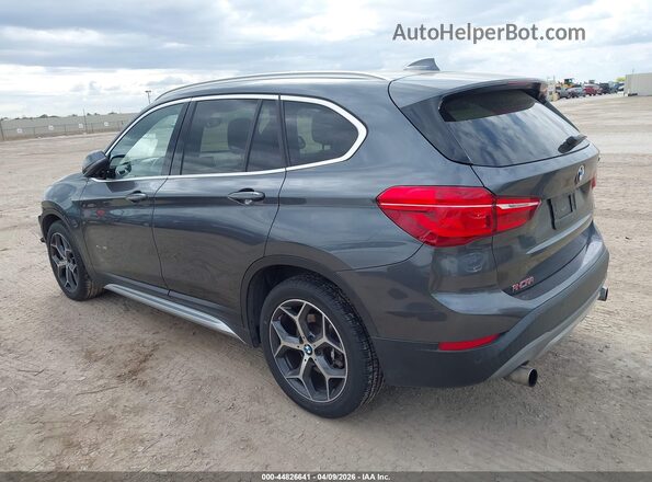 WBXHT3C31H5F78131 2017 BMW X1 Gray Rear left
