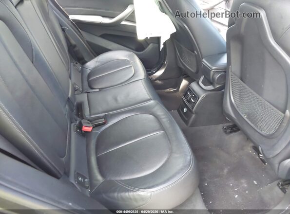 WBXHT3C34H5F79502 2017 BMW X1 Gray Widok naklejki z numerem VIN