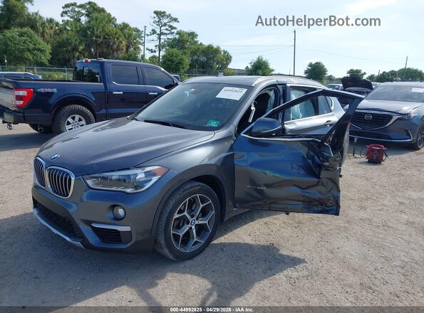 WBXHT3C34H5F79502 2017 BMW X1 Gray Przód lewy