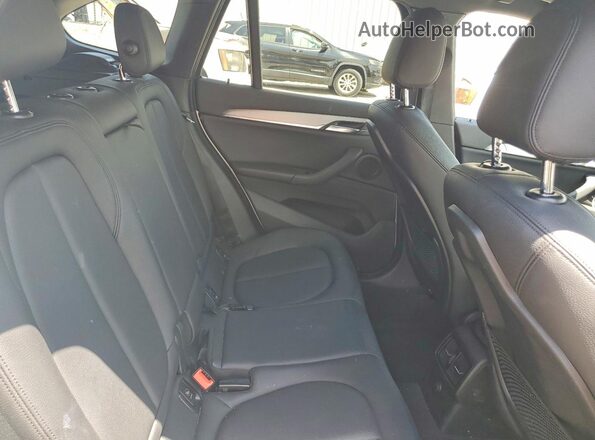 WBXHT3C35G5E56192 2016 BMW X1 White უკანა სალონის ხედი