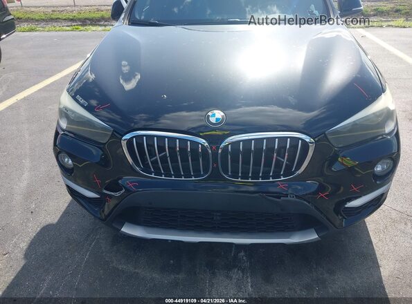 WBXHT3C38G5E52850 2016 BMW X1 Black Widok z przodu