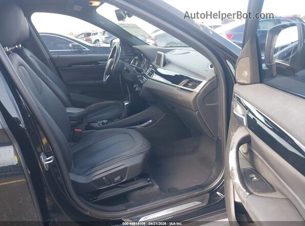 WBXHT3C38G5E52850 2016 BMW X1 Black Widok wnętrza z przodu