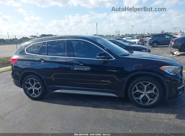 WBXHT3C38G5E52850 2016 BMW X1 Black Widok wnętrza z tyłu