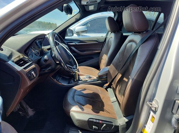 WBXHT3C38G5E56512 2016 BMW X1 Silver წინა სალონის ხედი