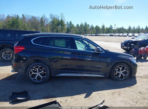 WBXHT3C38G5F64564 2016 BMW X1 Black Rear interior view
