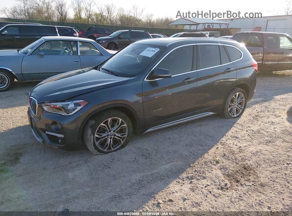 WBXHT3C38G5F66993 2016 BMW X1 Gray Front left