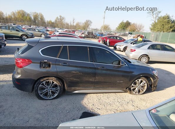 WBXHT3C38G5F66993 2016 BMW X1 Gray Rear interior view