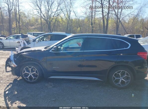 WBXHT3C38H5F73685 2017 BMW X1 Black Vista interior trasera