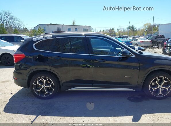 WBXHT3C39G5E50220 2016 BMW X1 Black Rear interior view