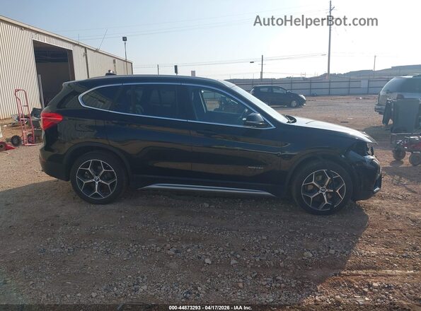 WBXHT3Z33G4A48156 2016 BMW X1 Black Rear interior view